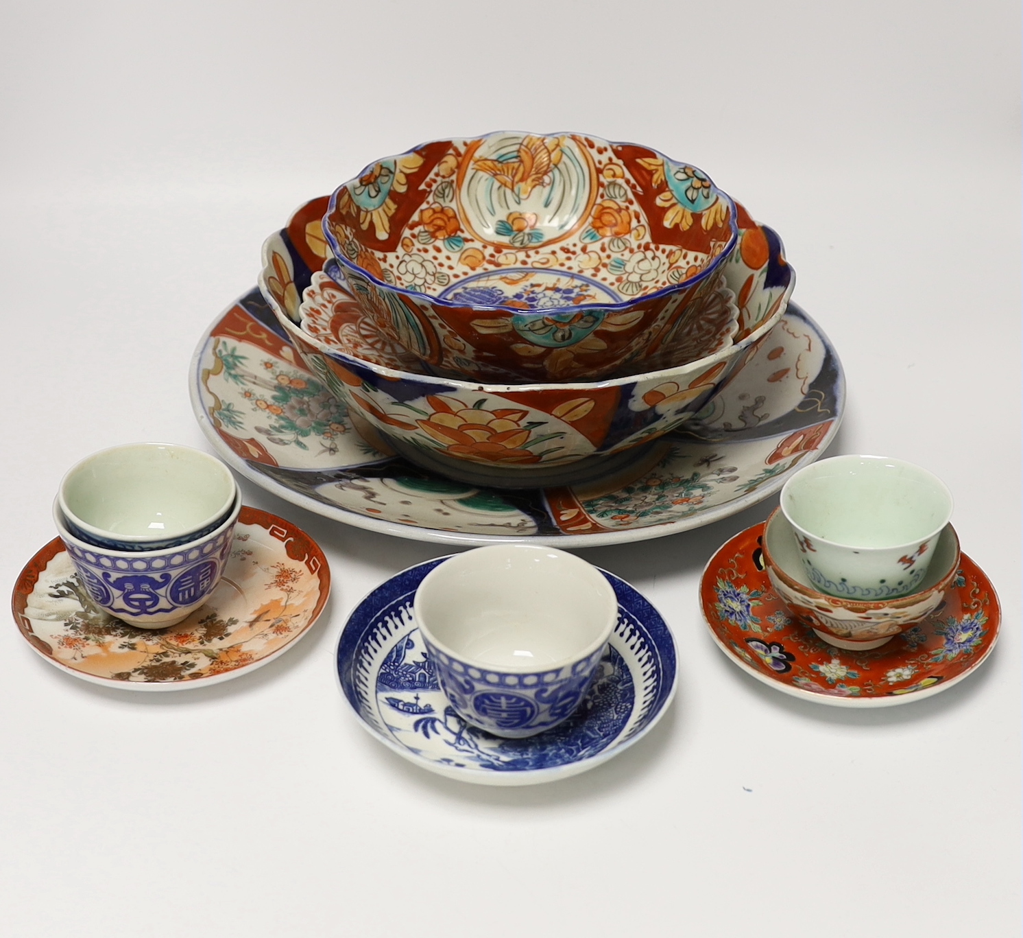 A group of Japanese Imari and kutani together with a Worcester blue and white saucer and a Chinese famille verte teabowl